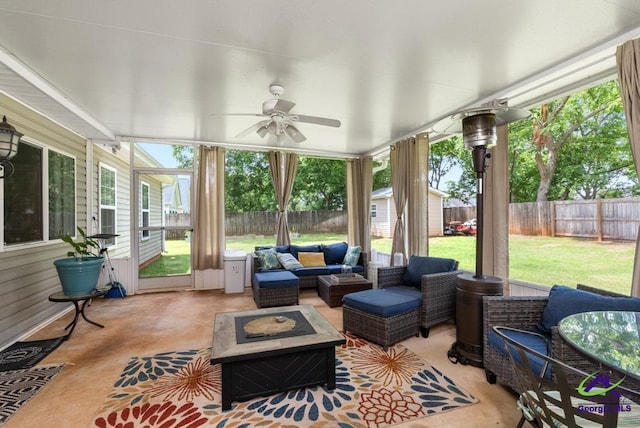 222 Duke Ln, Kathleen, GA 31047 - sunroom / solarium with an outdoor living space with a fire pit, ceiling fan, and plenty of natural light