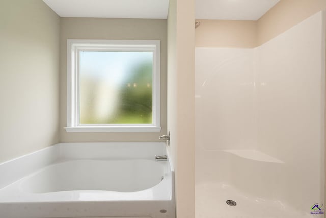 219 Christine Cir, Perry, GA 31069 - bathroom with a garden tub and a shower