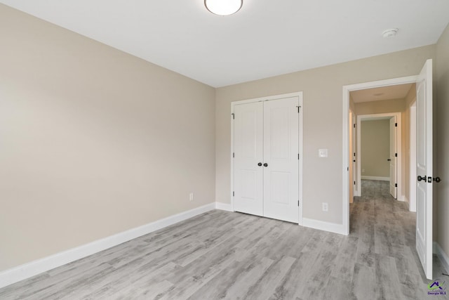 219 Christine Cir, Perry, GA 31069 - unfurnished bedroom with light wood finished floors and a closet
