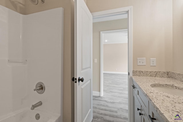 219 Christine Cir, Perry, GA 31069 - full bath with wood finished floors, shower / bath combination, and vanity