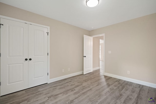 219 Christine Cir, Perry, GA 31069 - unfurnished bedroom featuring wood finished floors and a closet