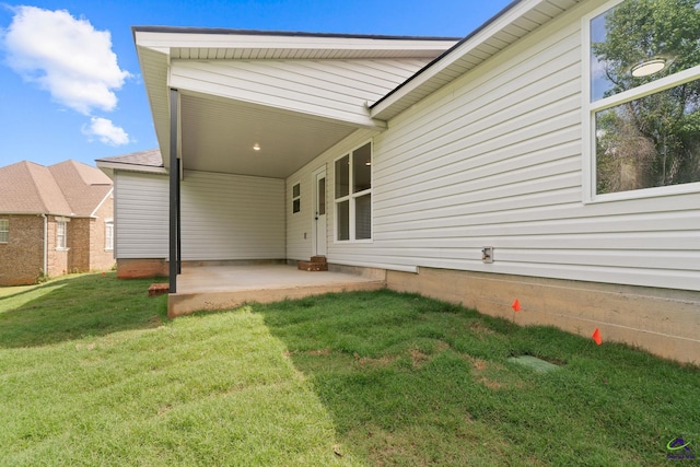 219 Christine Cir, Perry, GA 31069 - rear view of property with a patio, a yard, and a carport