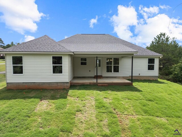 219 Christine Cir, Perry, GA 31069 - back of property with a yard, roof with shingles, and crawl space