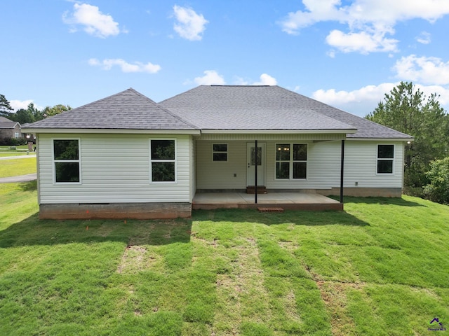 219 Christine Cir, Perry, GA 31069 - rear view of house with a shingled roof and a yard