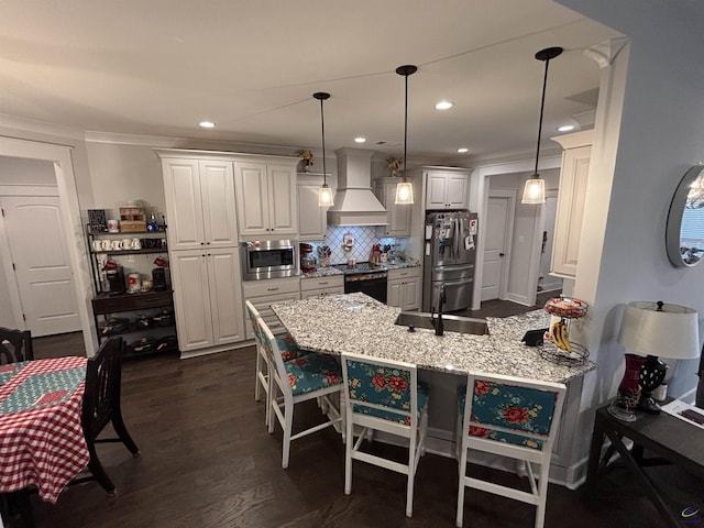 400 Rustic Live Oak Trl, Bonaire, GA 31005 - kitchen featuring stainless steel appliances, custom exhaust hood, a peninsula, a kitchen bar, and white cabinets