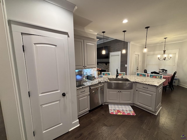 400 Rustic Live Oak Trl, Bonaire, GA 31005 - kitchen with dishwasher, a peninsula, dark wood finished floors, tasteful backsplash, and a chandelier