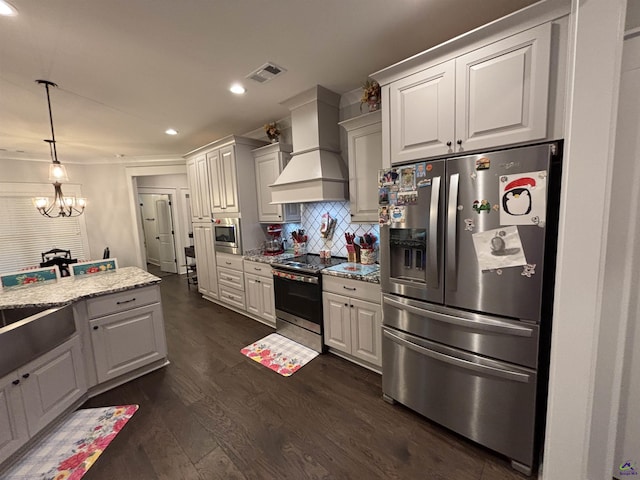 400 Rustic Live Oak Trl, Bonaire, GA 31005 - kitchen featuring stainless steel appliances, custom exhaust hood, recessed lighting, dark wood-type flooring, and tasteful backsplash