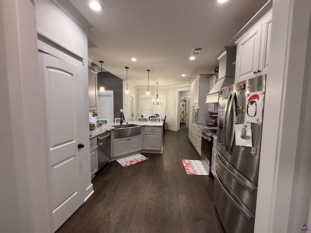 400 Rustic Live Oak Trl, Bonaire, GA 31005 - kitchen featuring stainless steel appliances, a peninsula, recessed lighting, dark wood finished floors, and pendant lighting