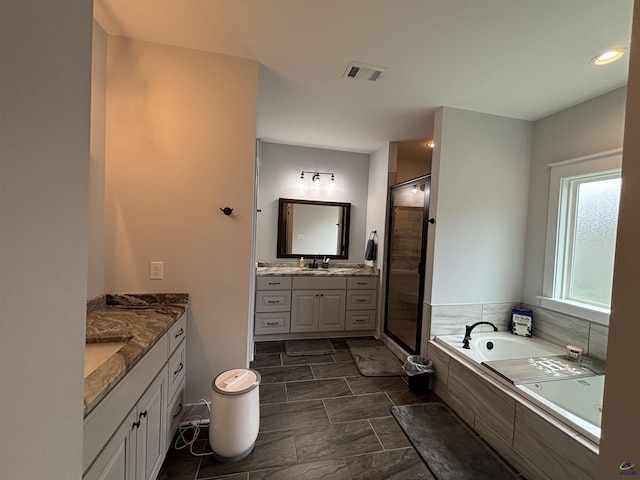 400 Rustic Live Oak Trl, Bonaire, GA 31005 - full bath with two vanities, a stall shower, and a garden tub
