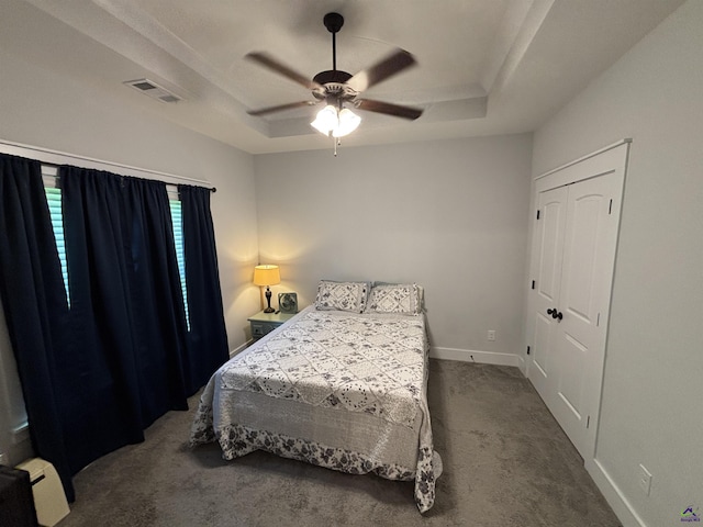 400 Rustic Live Oak Trl, Bonaire, GA 31005 - bedroom featuring carpet flooring, a raised ceiling, a baseboard heating unit, and a ceiling fan
