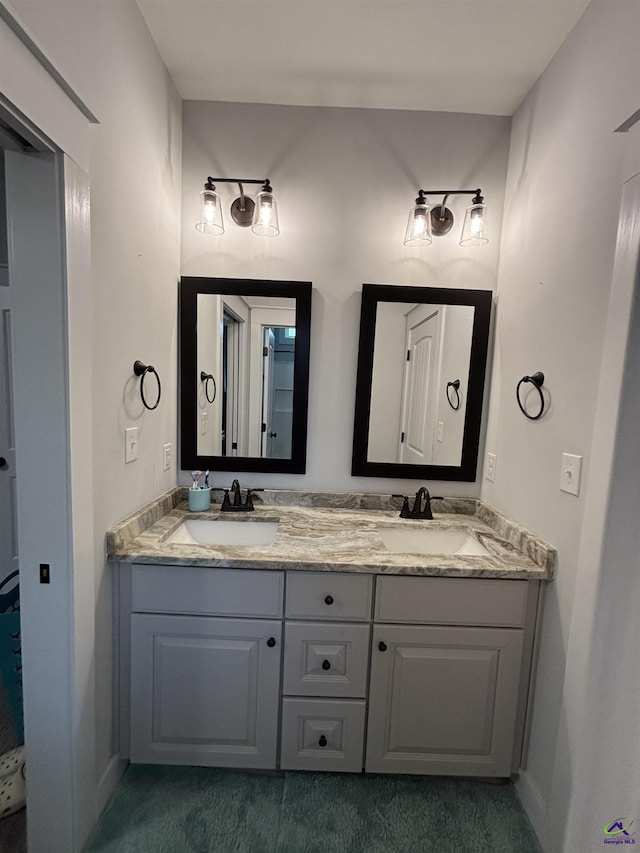 400 Rustic Live Oak Trl, Bonaire, GA 31005 - bathroom featuring double vanity and baseboards