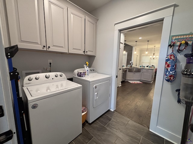 400 Rustic Live Oak Trl, Bonaire, GA 31005 - laundry room with cabinet space, independent washer and dryer, and a chandelier