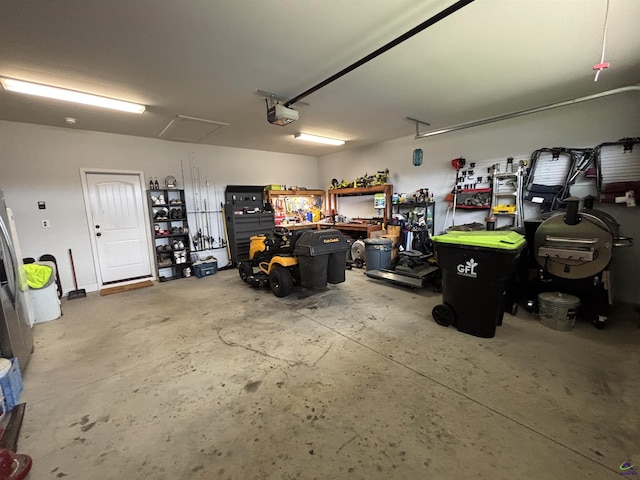 400 Rustic Live Oak Trl, Bonaire, GA 31005 - garage with a garage door opener and a workshop area