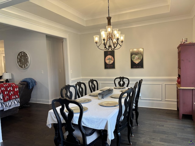400 Rustic Live Oak Trl, Bonaire, GA 31005 - dining area featuring a chandelier, dark wood-type flooring, a raised ceiling, ornamental molding, and wainscoting