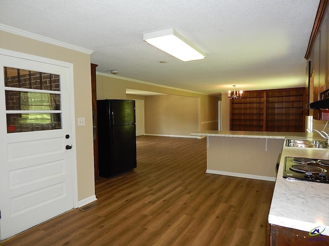 3498 Sandy Cir, Macon, GA 31216 - kitchen with black appliances, crown molding, a chandelier, light countertops, and dark wood finished floors