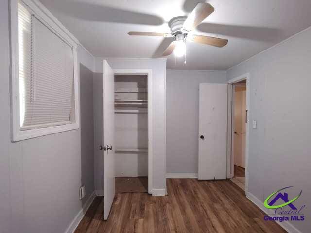 107 Roberts St, Warner Robins, GA 31093 - unfurnished bedroom featuring wood finished floors, a closet, and ceiling fan