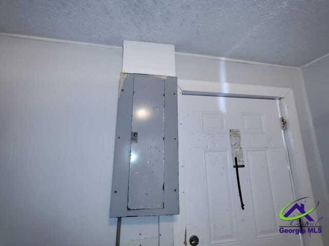 107 Roberts St, Warner Robins, GA 31093 - detailed view of a textured ceiling and electric panel