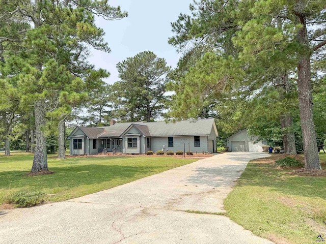 7285 Nowell Rd S, Macon, GA 31216 - single story home with an outbuilding, a front lawn, and a garage