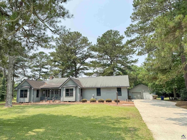 7285 Nowell Rd S, Macon, GA 31216 - ranch-style house featuring an outdoor structure, a detached garage, and a front lawn