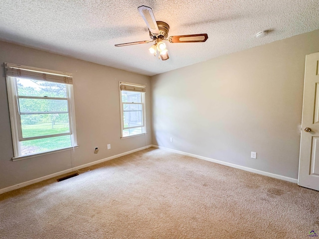 7285 Nowell Rd S, Macon, GA 31216 - spare room with carpet floors, a smoke detector, ceiling fan, and a textured ceiling
