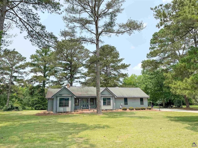 7285 Nowell Rd S, Macon, GA 31216 - ranch-style house featuring a front yard and a chimney