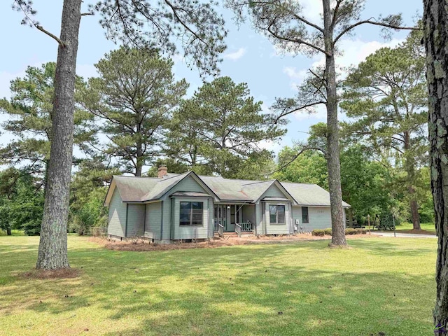 7285 Nowell Rd S, Macon, GA 31216 - view of front facade featuring a front yard and a chimney