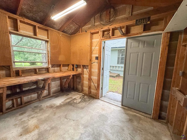 7285 Nowell Rd S, Macon, GA 31216 - miscellaneous room with unfinished concrete floors and lofted ceiling