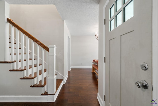 109 S Hiley Ct, Bonaire, GA 31005 - foyer entrance featuring wood finished floors, stairway, and a textured ceiling