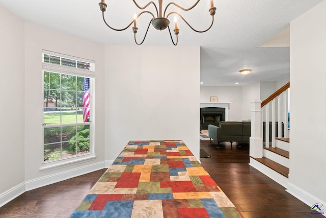 109 S Hiley Ct, Bonaire, GA 31005 - corridor featuring a chandelier, wood-type flooring, and stairway