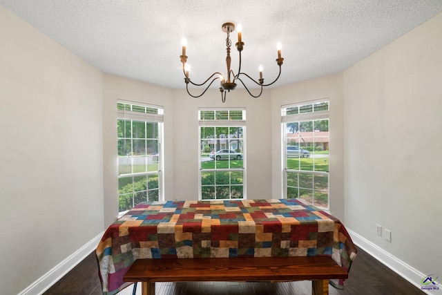 109 S Hiley Ct, Bonaire, GA 31005 - dining room with a chandelier, dark wood-style floors, and a textured ceiling