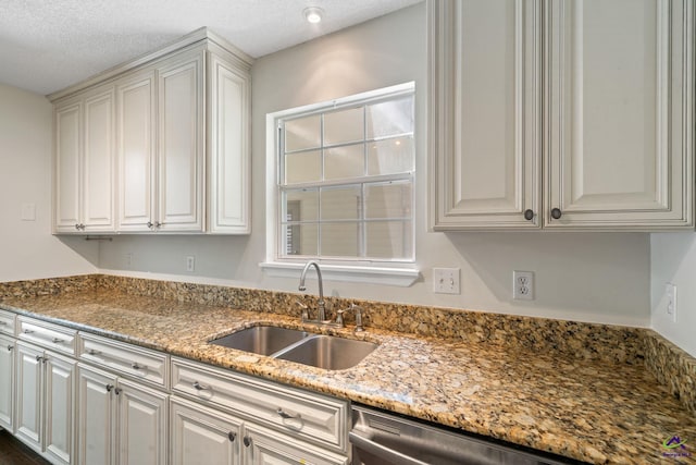 109 S Hiley Ct, Bonaire, GA 31005 - kitchen featuring light stone countertops, dishwasher, and a textured ceiling