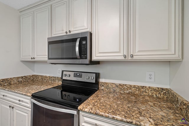 109 S Hiley Ct, Bonaire, GA 31005 - kitchen featuring stainless steel appliances, white cabinetry, and light stone countertops