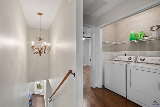 109 S Hiley Ct, Bonaire, GA 31005 - washroom with washer and clothes dryer, dark wood finished floors, and a chandelier