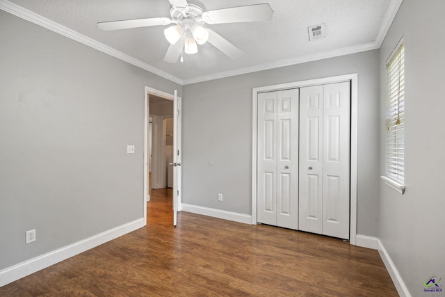 109 S Hiley Ct, Bonaire, GA 31005 - unfurnished bedroom with wood finished floors, crown molding, a closet, a textured ceiling, and a ceiling fan