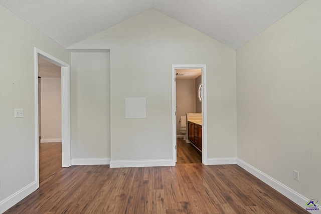 109 S Hiley Ct, Bonaire, GA 31005 - unfurnished bedroom with dark wood-type flooring and lofted ceiling