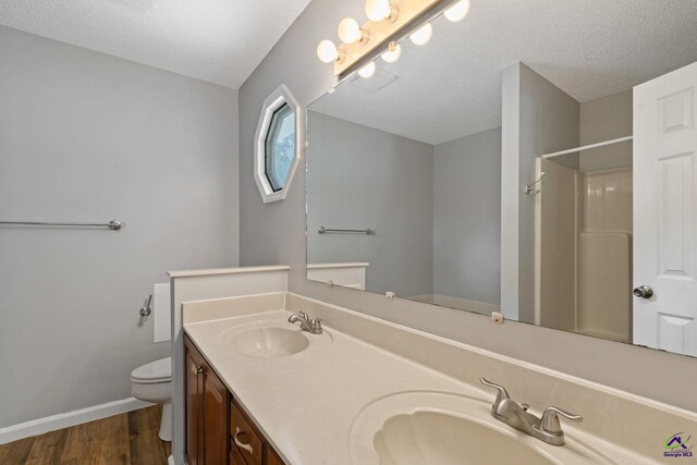 109 S Hiley Ct, Bonaire, GA 31005 - full bath with double vanity, wood finished floors, a textured ceiling, and a shower