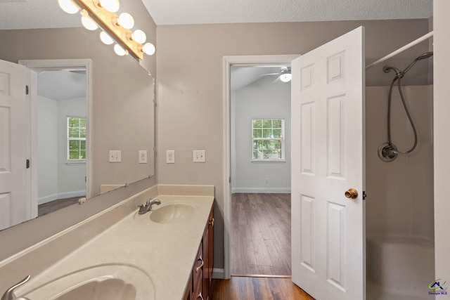 109 S Hiley Ct, Bonaire, GA 31005 - full bathroom featuring double vanity, wood finished floors, a shower, and ceiling fan