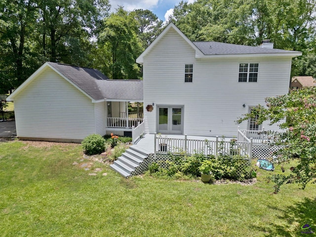 109 S Hiley Ct, Bonaire, GA 31005 - back of house with a chimney, a yard, a shingled roof, a porch, and view of scattered trees