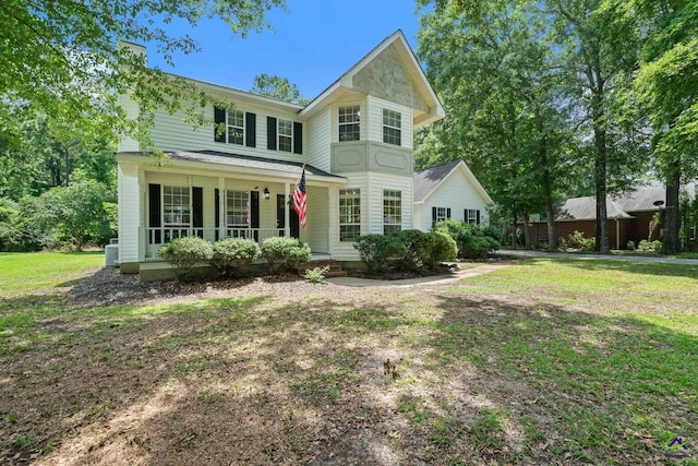 109 S Hiley Ct, Bonaire, GA 31005 - view of front of property featuring a porch, a chimney, and a front lawn