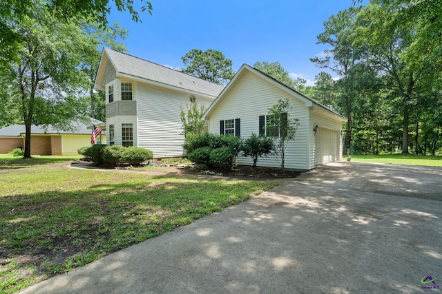 109 S Hiley Ct, Bonaire, GA 31005 - view of side of home with driveway, a garage, a lawn, crawl space, and an outbuilding