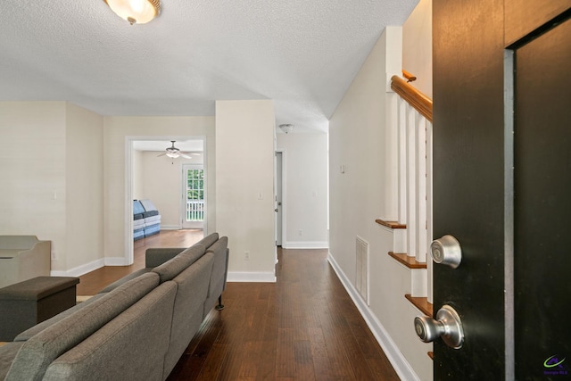 109 S Hiley Ct, Bonaire, GA 31005 - foyer featuring dark wood-style flooring, a textured ceiling, and a ceiling fan