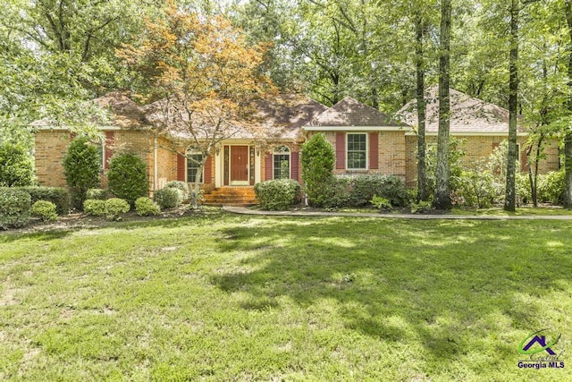 112 Springtime Dr, Warner Robins, GA 31088 - view of front of property with brick siding and a front lawn