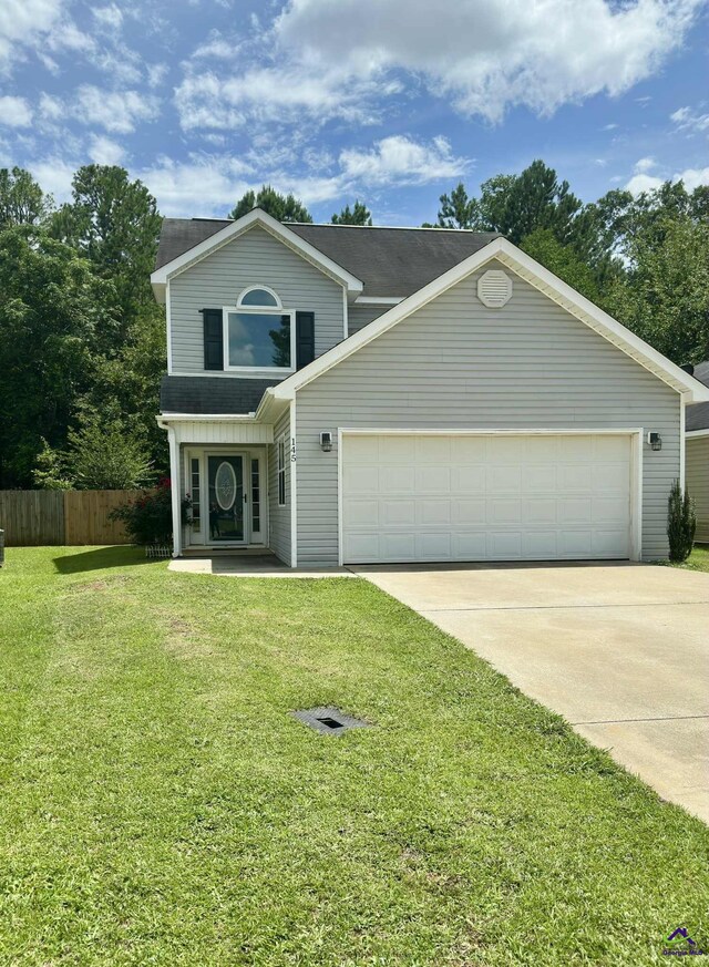 145 Rolling Woods Cir, Warner Robins, GA 31088 - traditional-style home with driveway and a garage