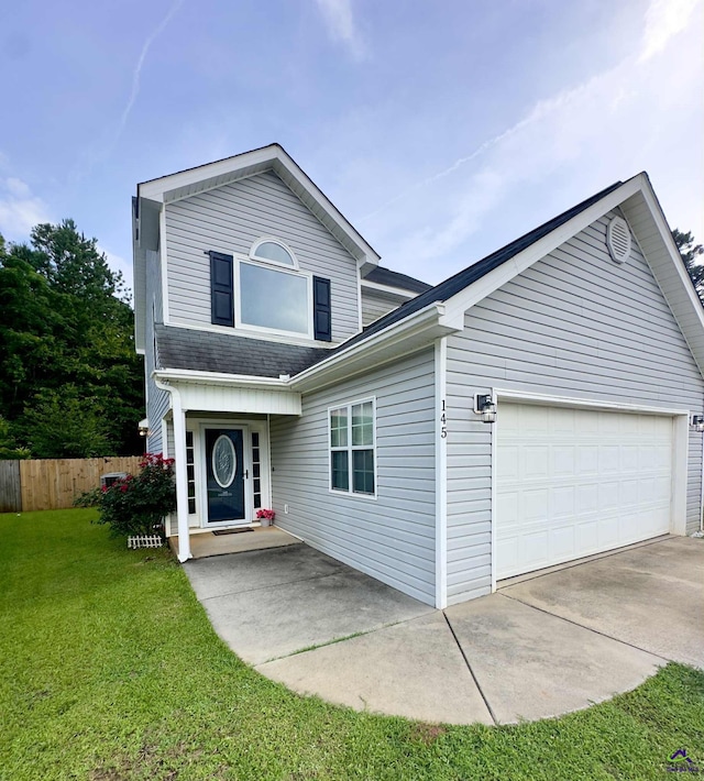 145 Rolling Woods Cir, Warner Robins, GA 31088 - traditional-style house with a shingled roof and a garage