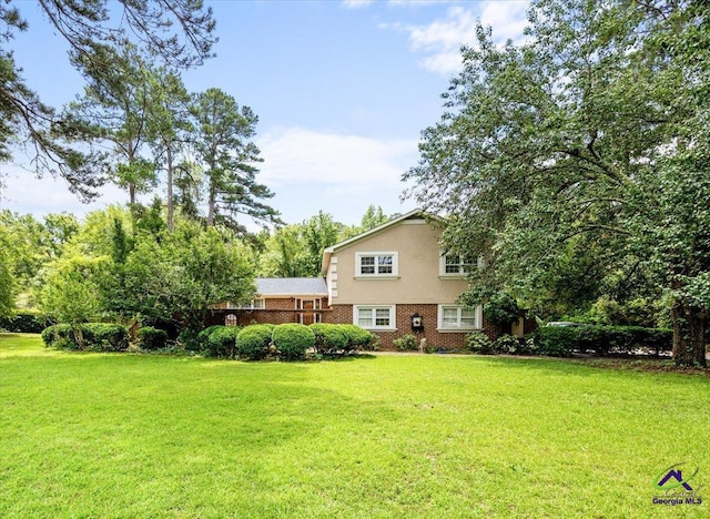 1414 Park Ave, Perry, GA 31069 - back of property with a yard and brick siding