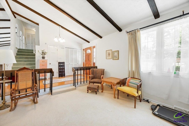 1414 Park Ave, Perry, GA 31069 - living area with carpet floors, stairway, and a chandelier