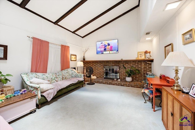 1414 Park Ave, Perry, GA 31069 - carpeted living room featuring high vaulted ceiling, a fireplace, and beam ceiling