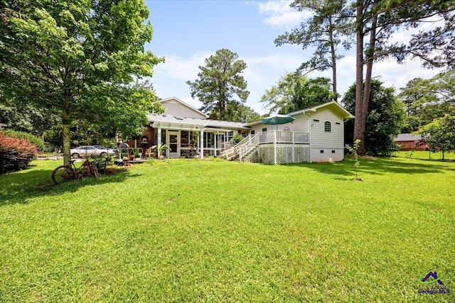 1414 Park Ave, Perry, GA 31069 - view of green lawn featuring a deck, a sunroom, and stairway