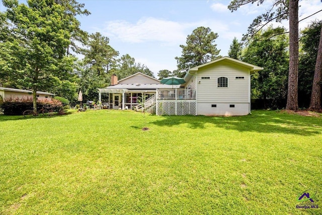 1414 Park Ave, Perry, GA 31069 - view of green lawn with a wooden deck and stairs