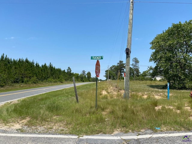82 Tucker Rd, Lizella, GA 31052 - view of asphalt road with traffic signs